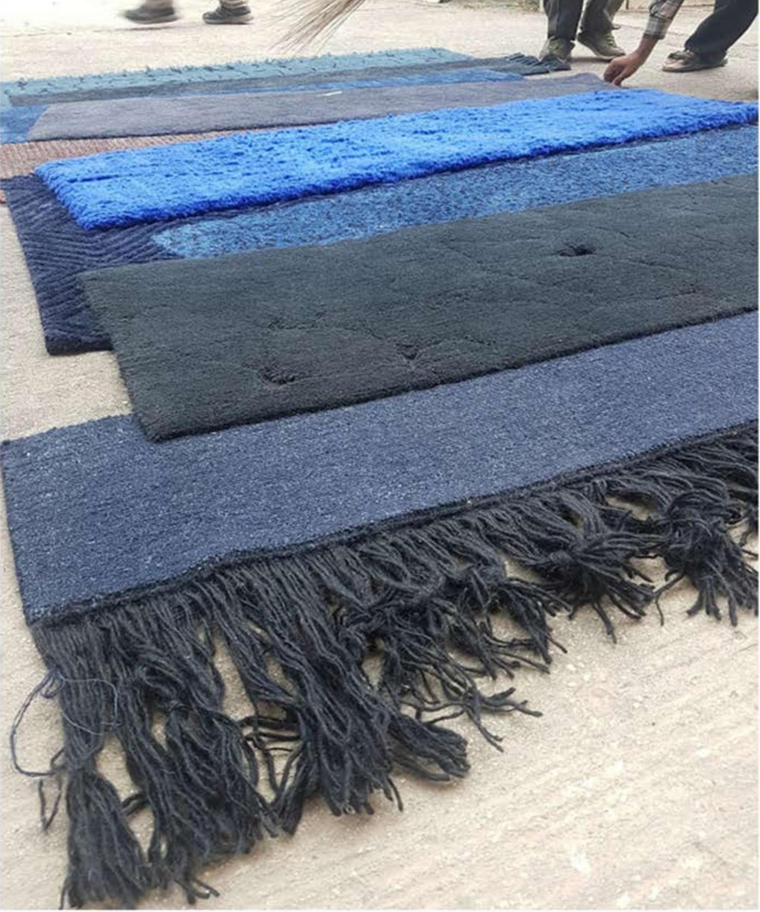 Strata rug — varying pile heights in indigo and charcoal